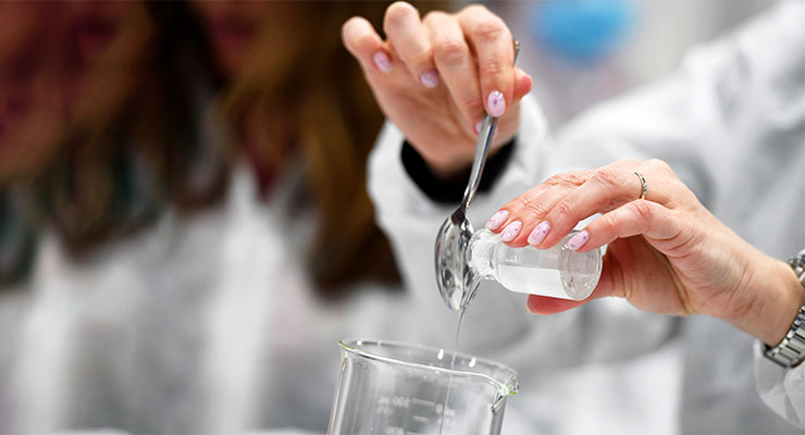 A modern hair products manufacturer team working on sustainable product evolution in a lab.