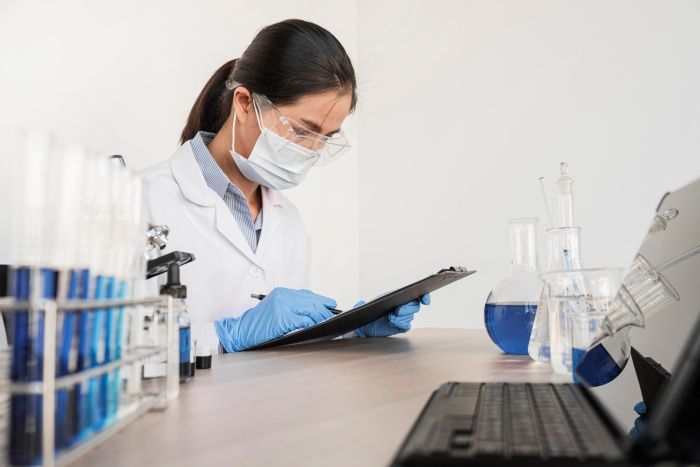 OEM cosmetics laboratory with scientist conducting research and development
